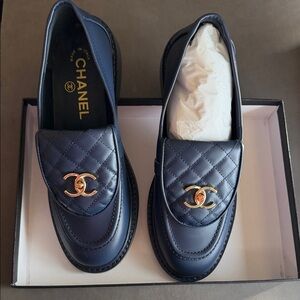 Similar to Chanel Dark Blue Quilted Loafers with Gold Logo
